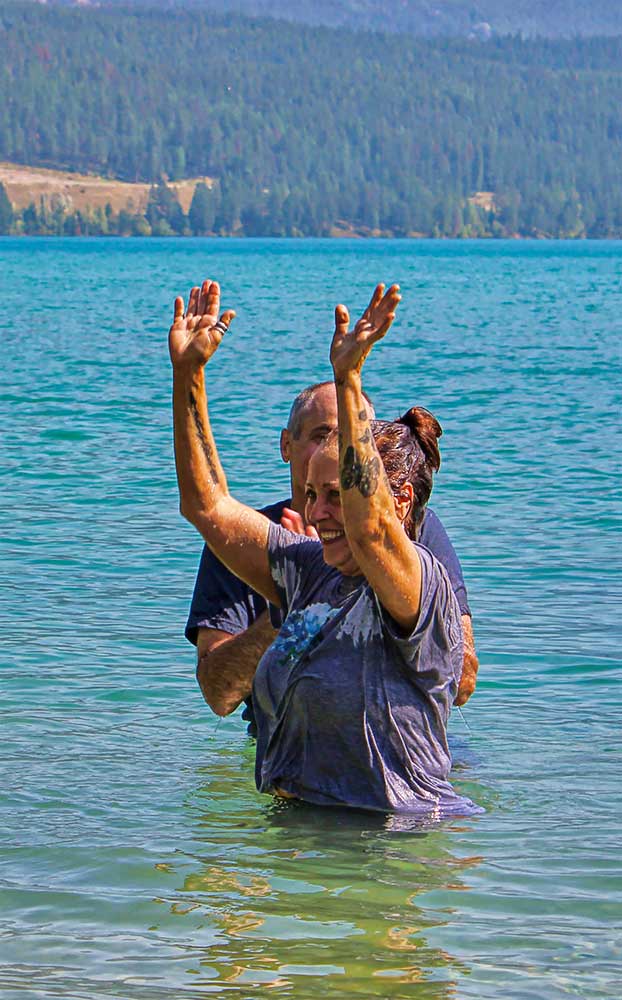 woman and pastor in dickey lake after she was baptized