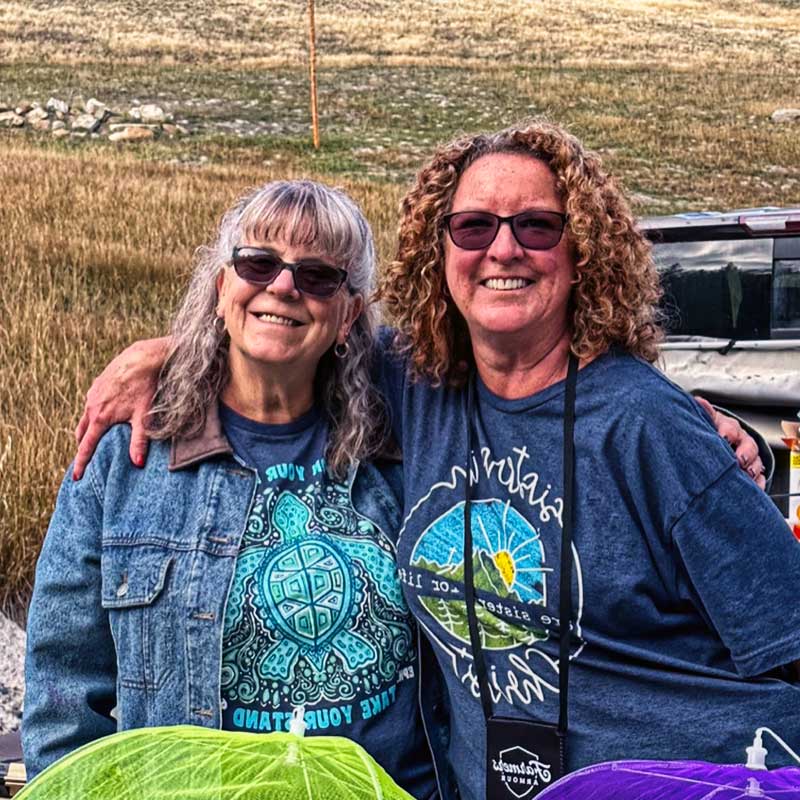 Two women smiling and posing for photo